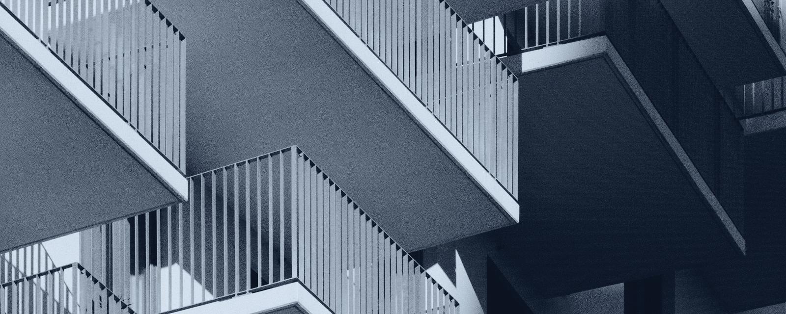 Apartment balconies in slate duotone — atmospheric imagery
